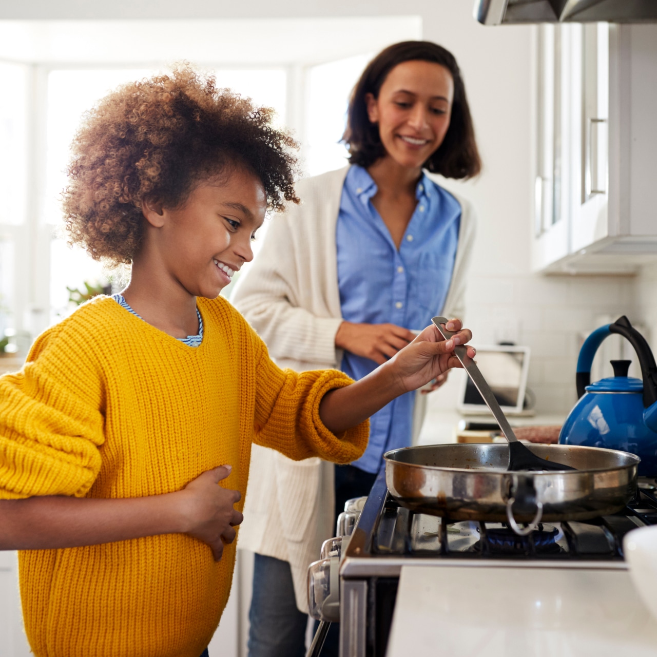 Parent and child cooking together